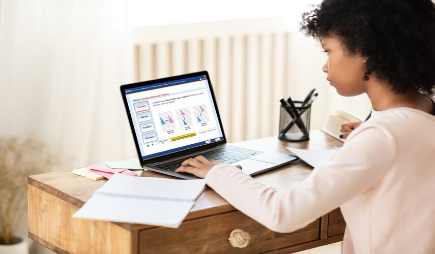 A curly-haired girl student is taking online math lesson using a Laptop displaying the Educo Learning Center Geometry Course